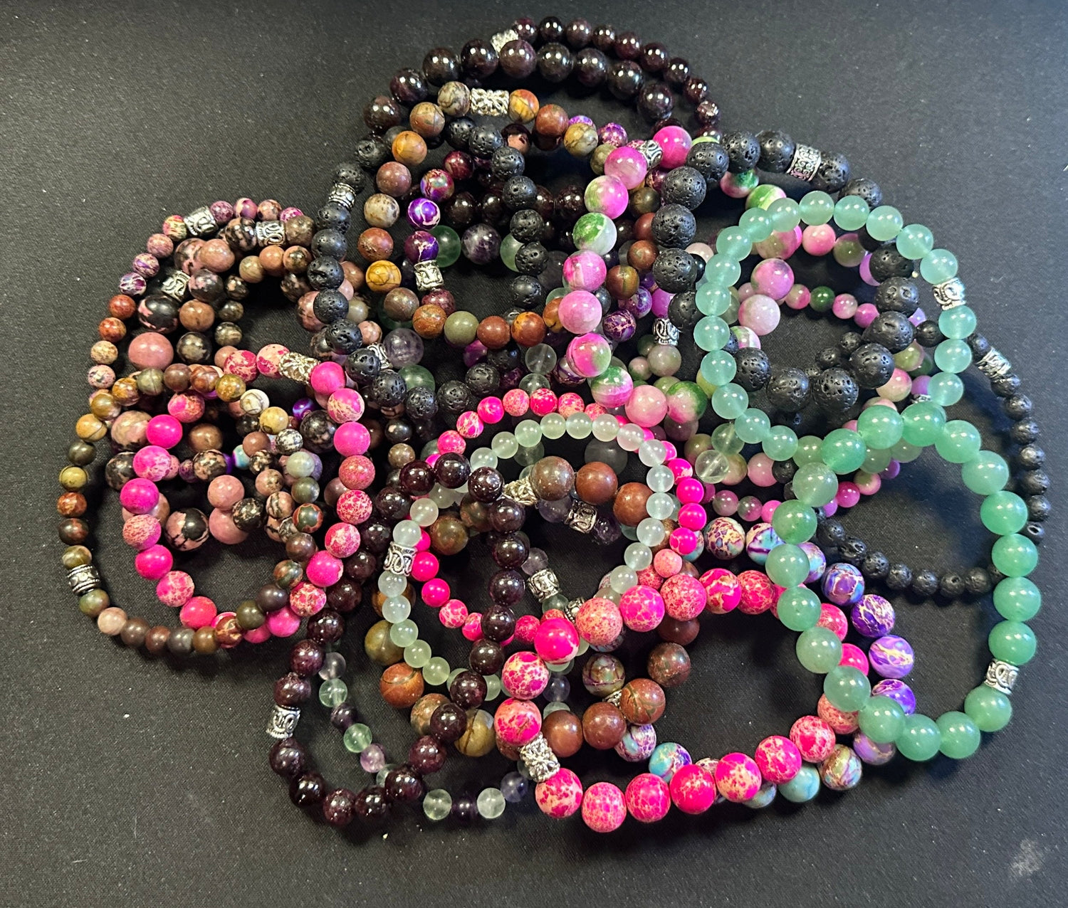 Pile of natural stone stretchy bracelets