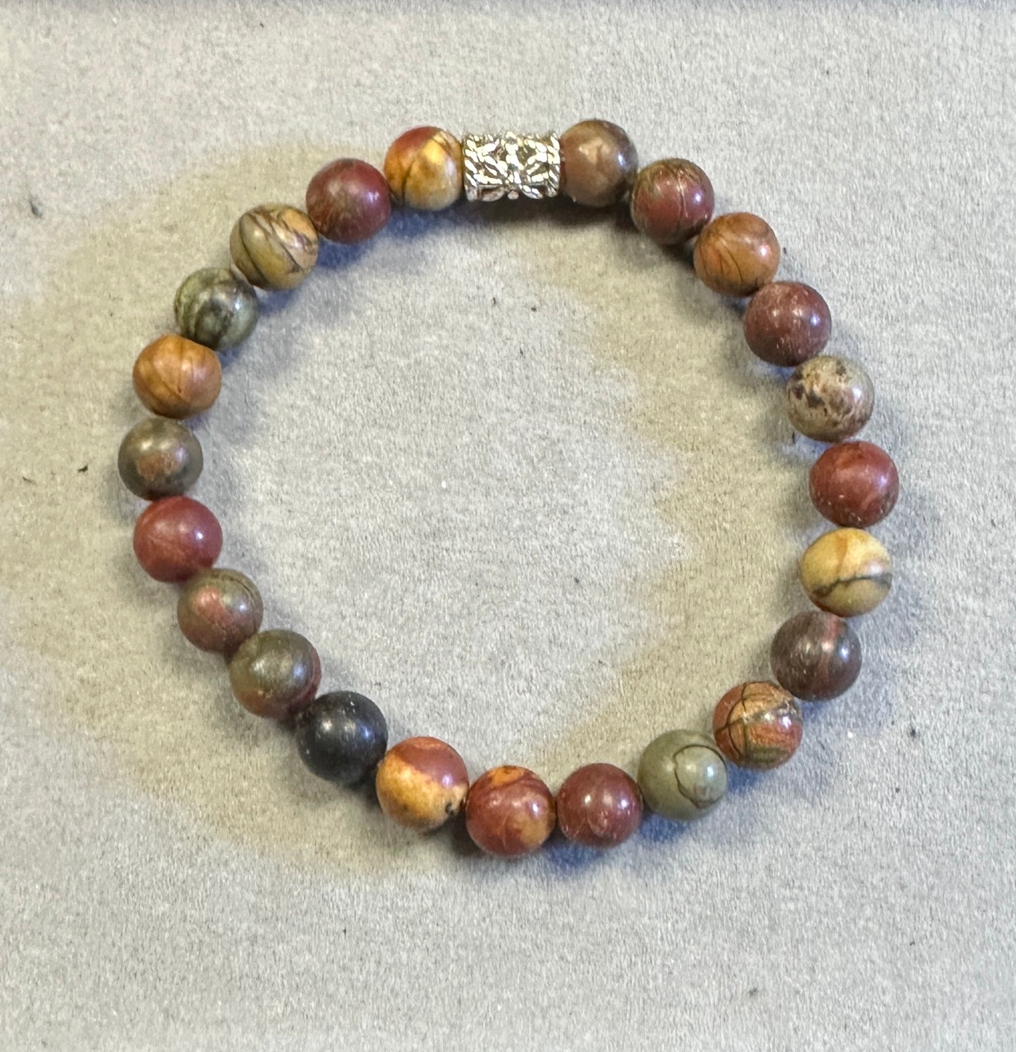 Multicolored beaded bracelet on a textured surface