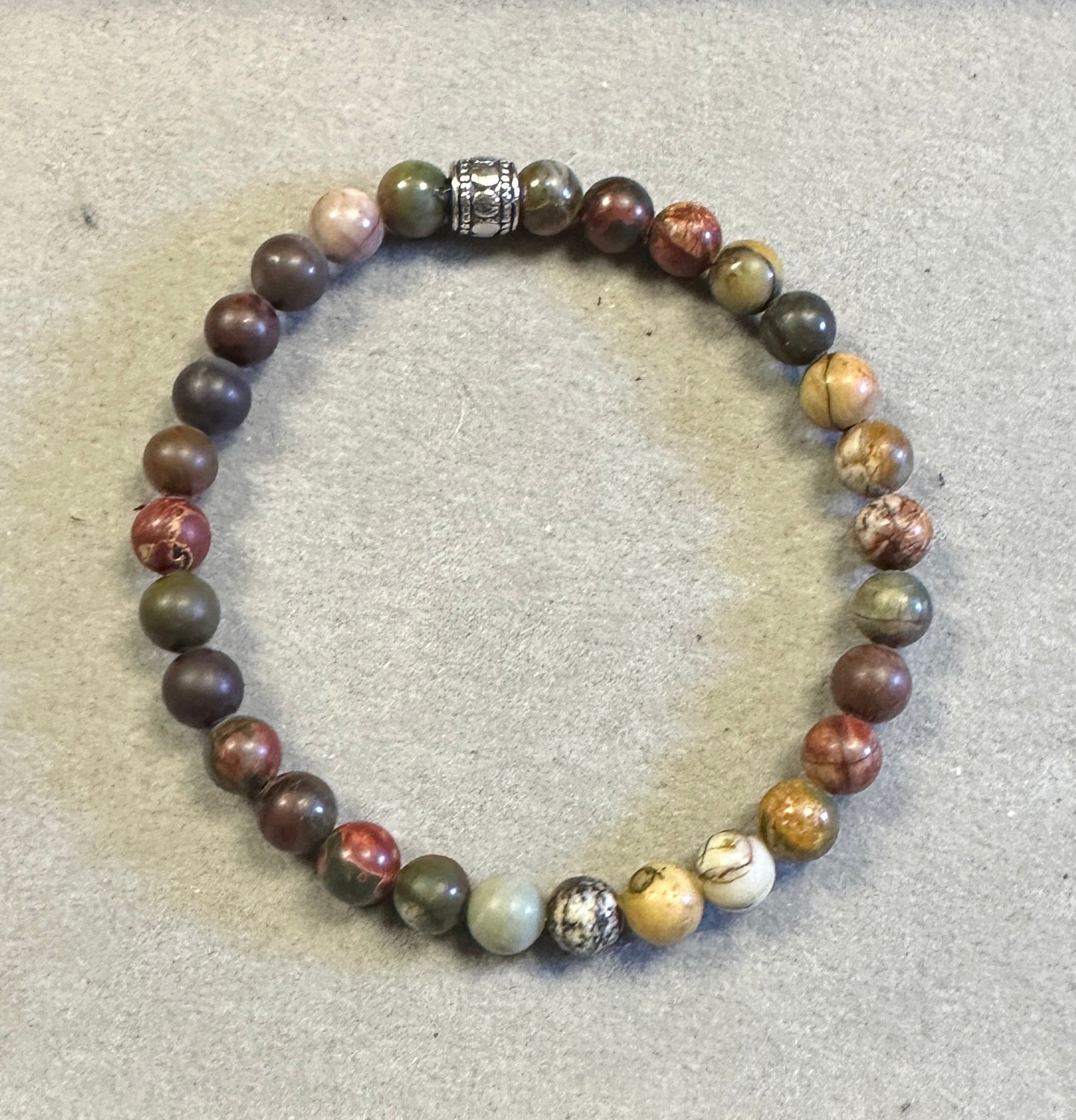 Multicolored beaded bracelet on a textured surface