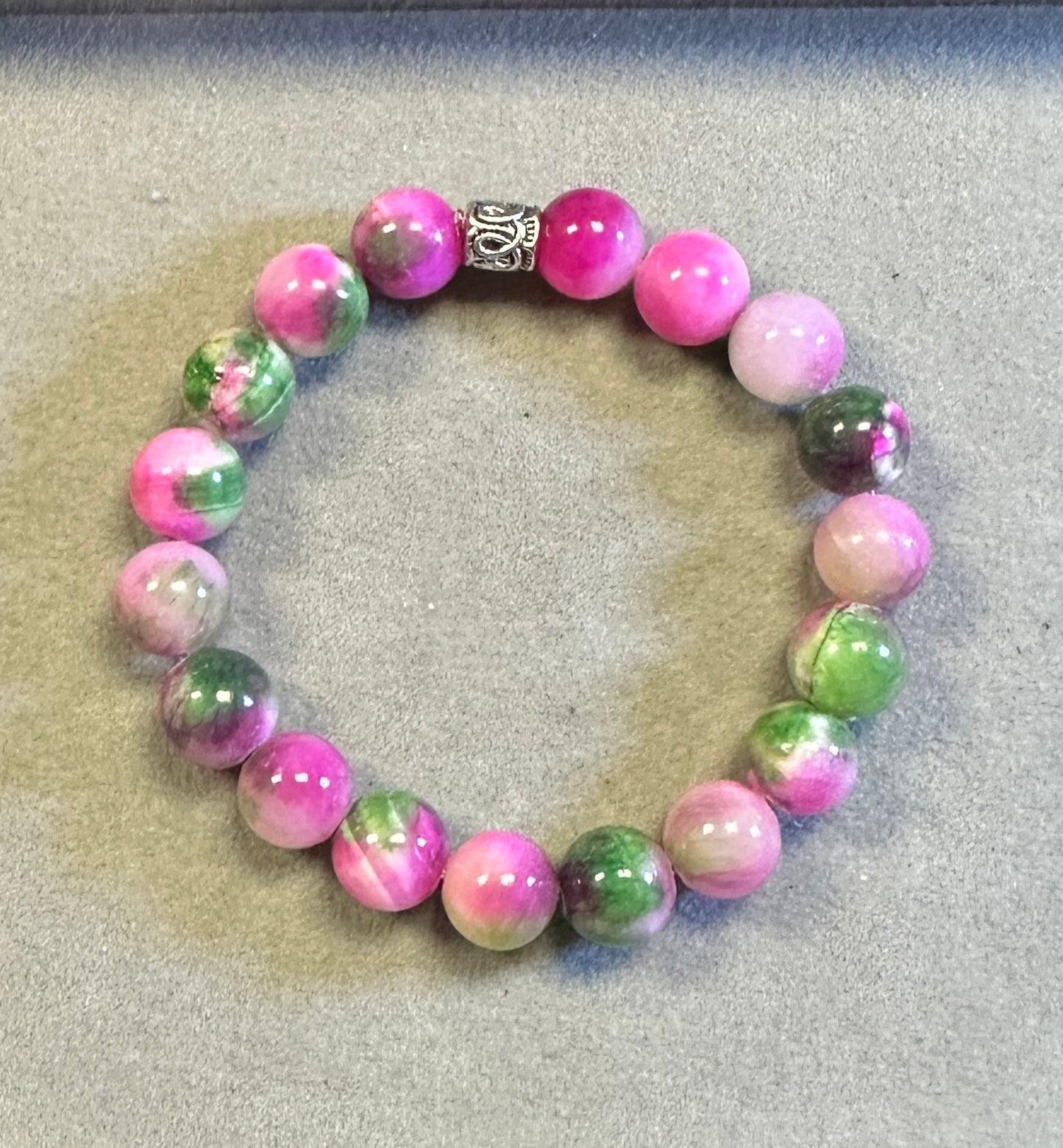 Multicolored beaded bracelet on a textured surface